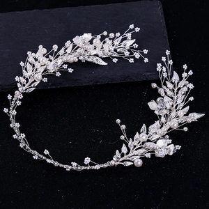 Detail showing silver leaf bridal headband with white pearls and sparkling crystals