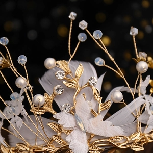Elegant bridal crown with golden branches, white pearls, crystals, feathers and lace butterfly