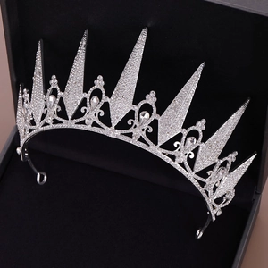 Close-up of bridal crystal tiara with teardrop gems on dark velvet jewelry box