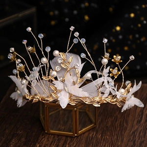 Exquisite bridal crown with gold leaves, white pearls, crystals and soft feather accents