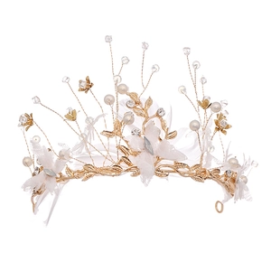 Handmade bridal crown with white feathers, lace flowers and gold wire branch design