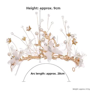 Detail view of handmade bridal crown showing 9cm height and 28cm length with white feathers