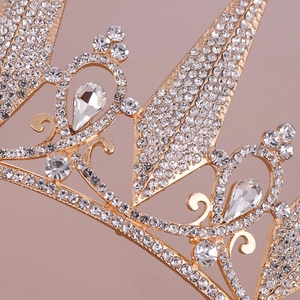 Elegant gold bridal tiara with sparkling crystal rhinestones and pear-shaped accents