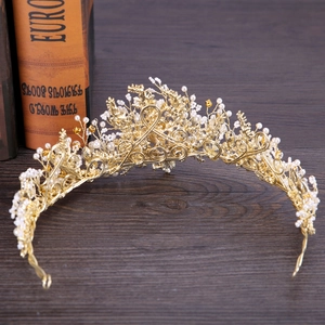 Elegant gold bridal crown featuring white pearls and handmade floral wire weaving