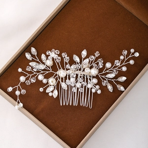 Elegant bridal hair comb with pearls and crystals on a premium dark velvet display box