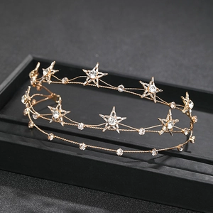 Macro detail of bridal headband featuring gold stars and shimmering crystals decoration