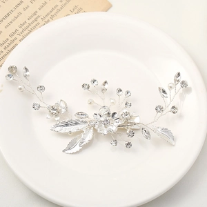 Elegant silver leaf hair clip with rhinestones and pearls for bridal wedding styling