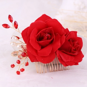 Elegant bridal hair comb with red fabric roses, gold leaves, and crystal pearls