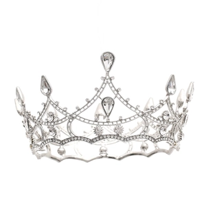 Close-up of silver baroque crown with round and teardrop crystal rhinestones