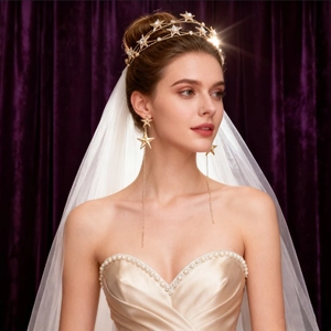 Elegant gold bridal headband with sparkling stars and matching long dangling earrings