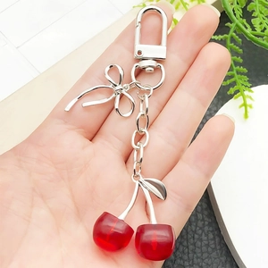 Creative red resin cherry keychain with silver metal bow and lobster clasp for bags