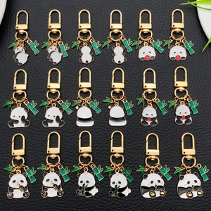 Collection of 18 cute panda enamel keychains with bamboo charms on gold metal base