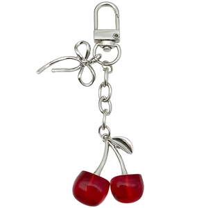Creative red cherry keychain with silver bow ornament and metallic leaf hanging charm
