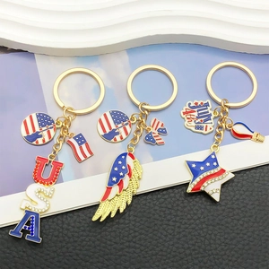 Three gold patriotic USA Independence Day heart and star enamel keychains with rhinestones