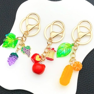 Creative fruit keychain set with resin grape apple and orange charms on gold ring