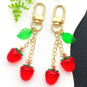 Creative resin strawberry keychain with green leaves and gold chain for bags and keys