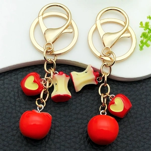Cute red resin apple keychain set with heart cutout and golden metal spring clasp