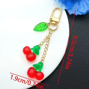 Detail shot of cute cherry resin keychain with size measurements 9.5cm in length
