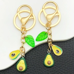 Set of 2 creative 3D avocado keychains with gold lobster clasps and green leaf charms