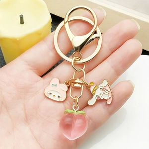 Cute Cinnamoroll and My Melody keychain with peach resin charm on golden metal ring