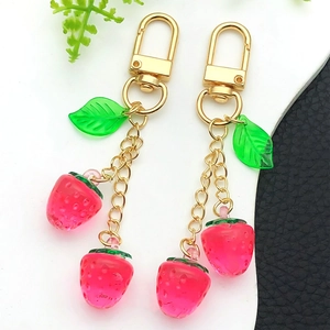 Creative cute pink resin strawberry keychain with green leaves and gold chain