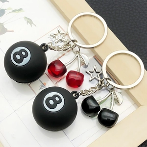 Creative keychain set with black 8-ball billiards and cute cherry charms in a frame