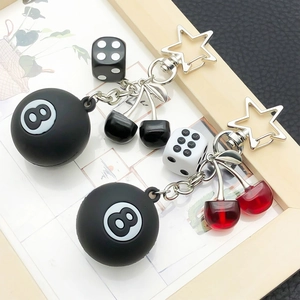 Creative black 8 ball keychain with cute cherry charms and dice on a star clasp