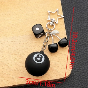Detail of billiards number 8, black cherry and dice keychain with size measurements