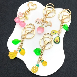 Creative 3D fruit keychains set featuring resin banana strawberry and peach charms