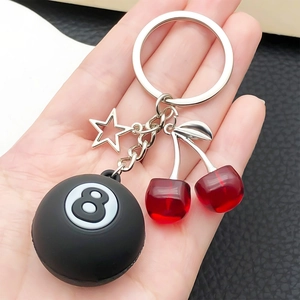 Creative keychain featuring red resin cherries, hollow star, and black number 8 pool ball charm