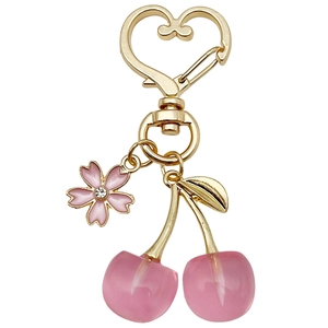 Pink resin cherry keychain with enamel sakura flower charm and golden heart clasp
