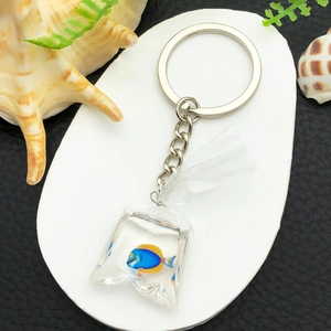 Creative resin tropical fish in a water bag keychain with blue and yellow ocean theme