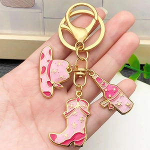 Pink western cowboy hat and boot keychain with gold-plated star and bottle charms