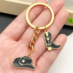 Retro western cowboy hat and boot keychain with black enamel and star charms