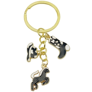 Western cowboy keychain featuring gold horse, hat, and boot charms with black enamel finish
