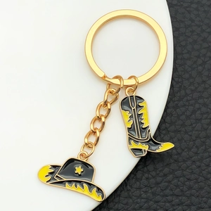 Porte-clés vintage doré chapeau et botte de cowboy avec motif étoile et émail noir