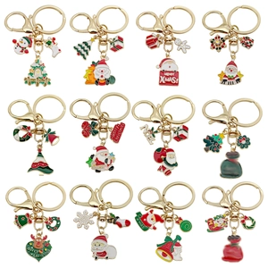 Set of 12 cute Christmas metal keychains featuring Santa Claus and reindeer icons