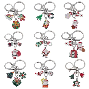Assorted Christmas metal keychains featuring Santa, reindeer, and trees in a 9-grid layout