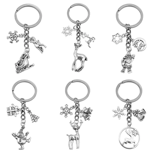 Set of 6 vintage silver Christmas keychains with Santa Claus, Reindeer and Snowman designs