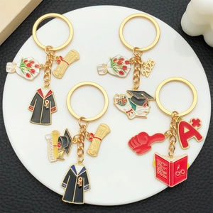 2025 Graduation Keychain with mortarboard gown and A+ charms in gold finish