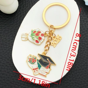 Detail showing the 8.1cm length dimensions of the 2025 graduation keychain with tulip