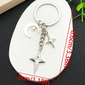 Detail view showing dimensions of a silver moon and star metal keychain ornament