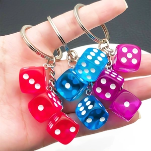 Three-link colorful resin dice keychain with transparent red, blue, and purple cubes