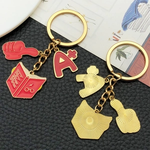 Academic red enamel A plus and book keychain set with golden metallic finish