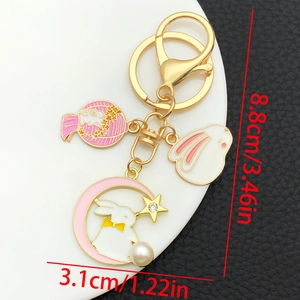 Detail view of cartoon rabbit keychain with pink moon and pearl, length 8.8cm