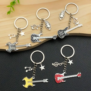 Variety of electric guitar metal keychains with musical notes and microphone pendants