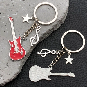 Detailed front and back views of red electric guitar keychain with star and music note