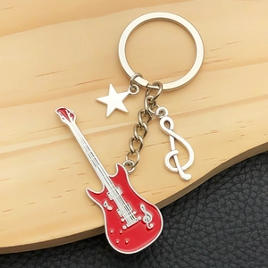 Rock music keychain with red electric guitar, silver star and treble clef pendant charm