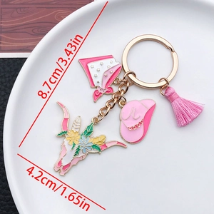 Détail du porte-clés cowboy rose avec crâne de taureau fleuri et dimensions indiquées