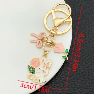 Close-up of rabbit rose keychain with dimensions showing 8.5cm height and 3cm width
